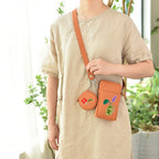 whimsical flora and ceramic vase embroidered stick-on patches on a crossbody bag