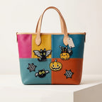 five halloween patches with bat-wing cat jack-o-lantern spider bat and cobweb on a bold multicolor leather bag