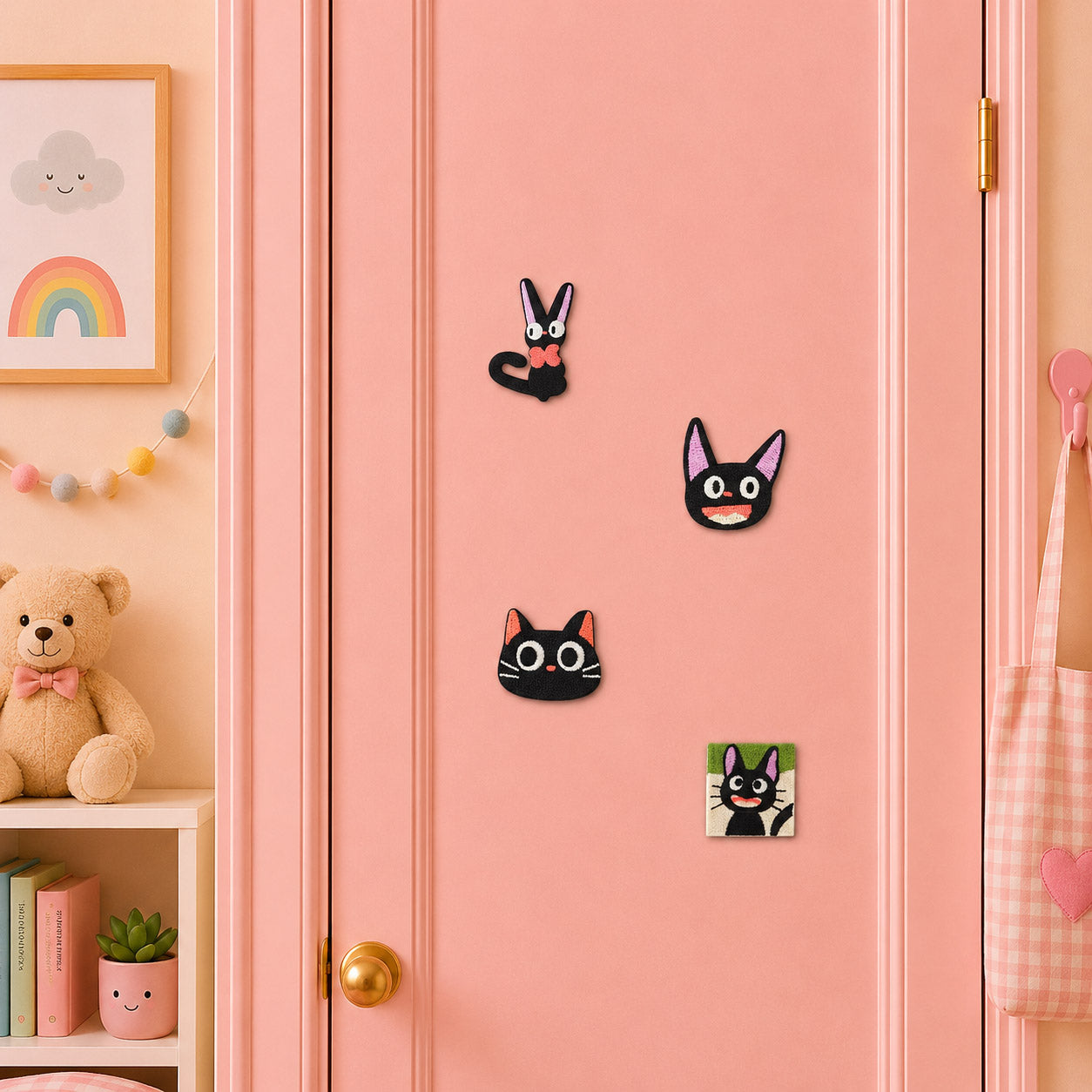 anime jiji style black cat with white eyes pink ribbon bow overhead view laughing face and green framed full body stick-on patches on a pink door in a pastel room