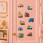 yellow taxi green water truck excavator red fire engine blue cargo truck police van oil tanker helicopter van and orange bulldozer stick-on patches on a pink door in a pastel room