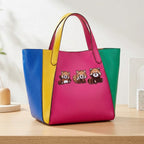 three red panda patches with laughing shy and playful expressions on a pink yellow and green handbag