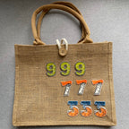 numeric embroidered patches spelling 999 777 555 on a burlap tote bag
