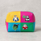 shiba inu, panda, black cat, and dog embroidered patches on a colorblock leather cosmetic pouch