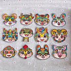 Chinese zodiac animal embroidered stick-on patches complete set of 12 — all zodiac signs in traditional Chinese opera face-paint style with star pupils and colorful forehead patterns