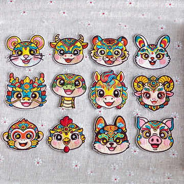 Chinese zodiac animal embroidered stick-on patches complete set of 12 — all zodiac signs in traditional Chinese opera face-paint style with star pupils and colorful forehead patterns
