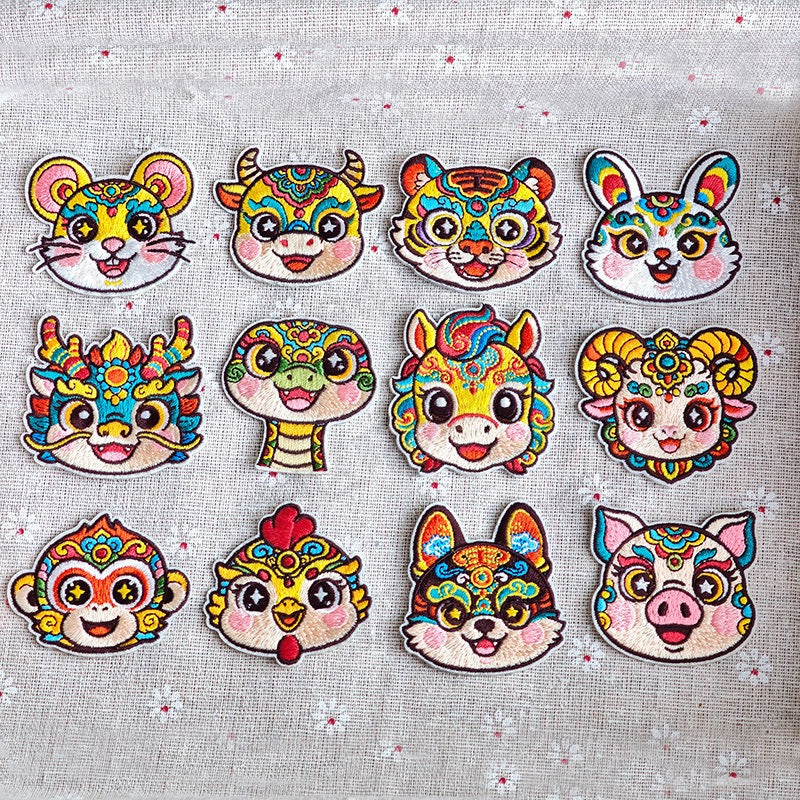 Chinese zodiac animal embroidered stick-on patches complete set of 12 — all zodiac signs in traditional Chinese opera face-paint style with star pupils and colorful forehead patterns