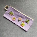 groovy plant and flower embroidered patches on a lavender canvas pencil case