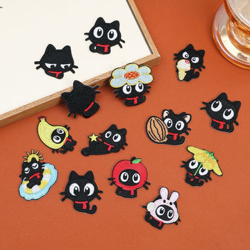 Fourteen red scarf black cat embroidered stick-on patches with playful costumes, poses, and accessories
