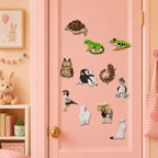 realistic exotic creature patches including red-eyed tree frog secretary bird blue-footed booby leopard gecko alpaca and bighorn sheep on a pink door in a pastel room