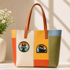 black cat silhouette in round and arch rainbow stripe window stick-on patches decorating a multicolor stripe leather handbag
