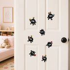 kawaii soot sprite embroidered stick-on patches decorating a door