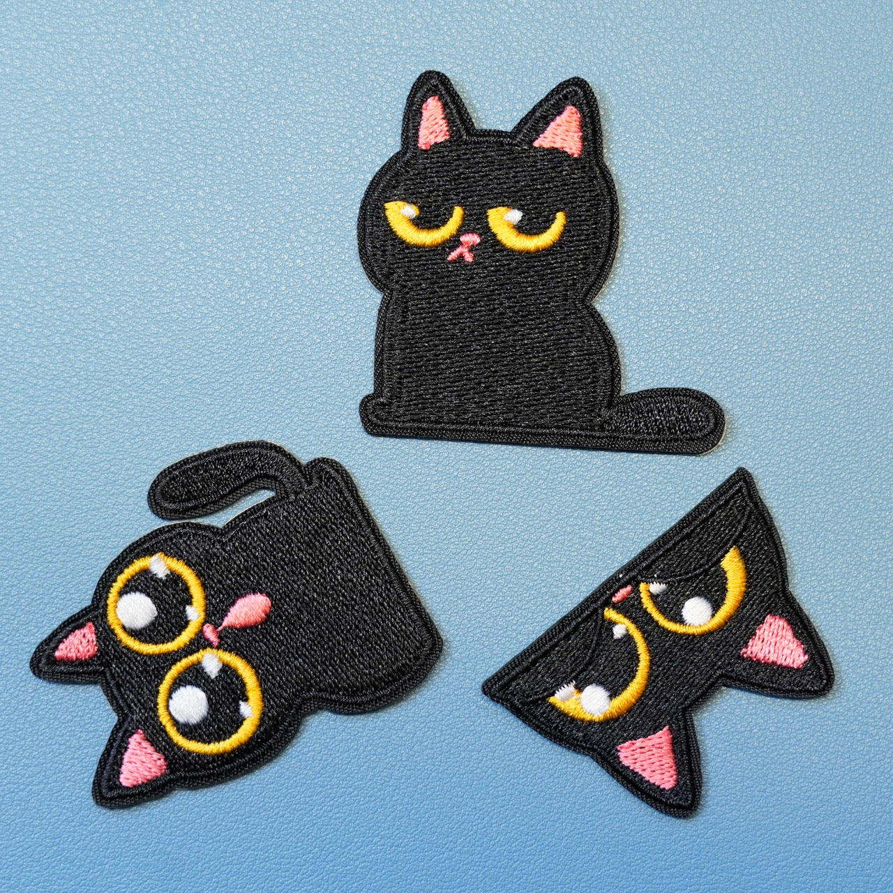 full set of 3 big-eyed cat embroidered patches flat lay 