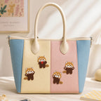 fluffy red panda in playful poses stick-on patches decorating a cream pink and blue stripe leather handbag