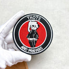 thots and prayers embroidered stick-on patch held in hand showing round badge design