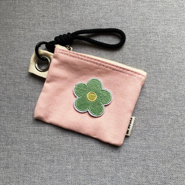 pastel macaron flower embroidered stick-on patch on a canvas card holder