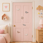 white and grey fluffy harp seal sitting lying and swimming stick-on patches scattered on a pink bedroom door with heart decor