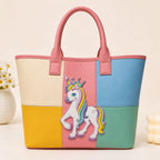 rainbow mane unicorn with crown embroidered patch on a pastel color-block leather tote bag