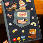 dreamy star embroidered stick-on patches on a journal cover