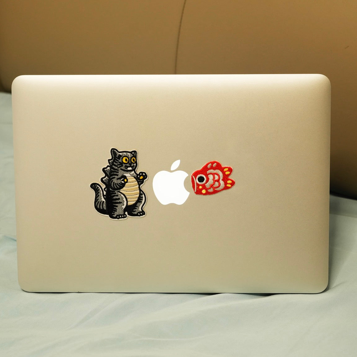 Japanese koi fish embroidered patch sticker on a laptop