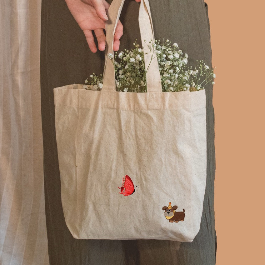 vibrant embroidery butterfly stick-on patch on a canvas bag