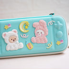 fluffy bouclé teddy bear embroidered stick-on patch on game console case