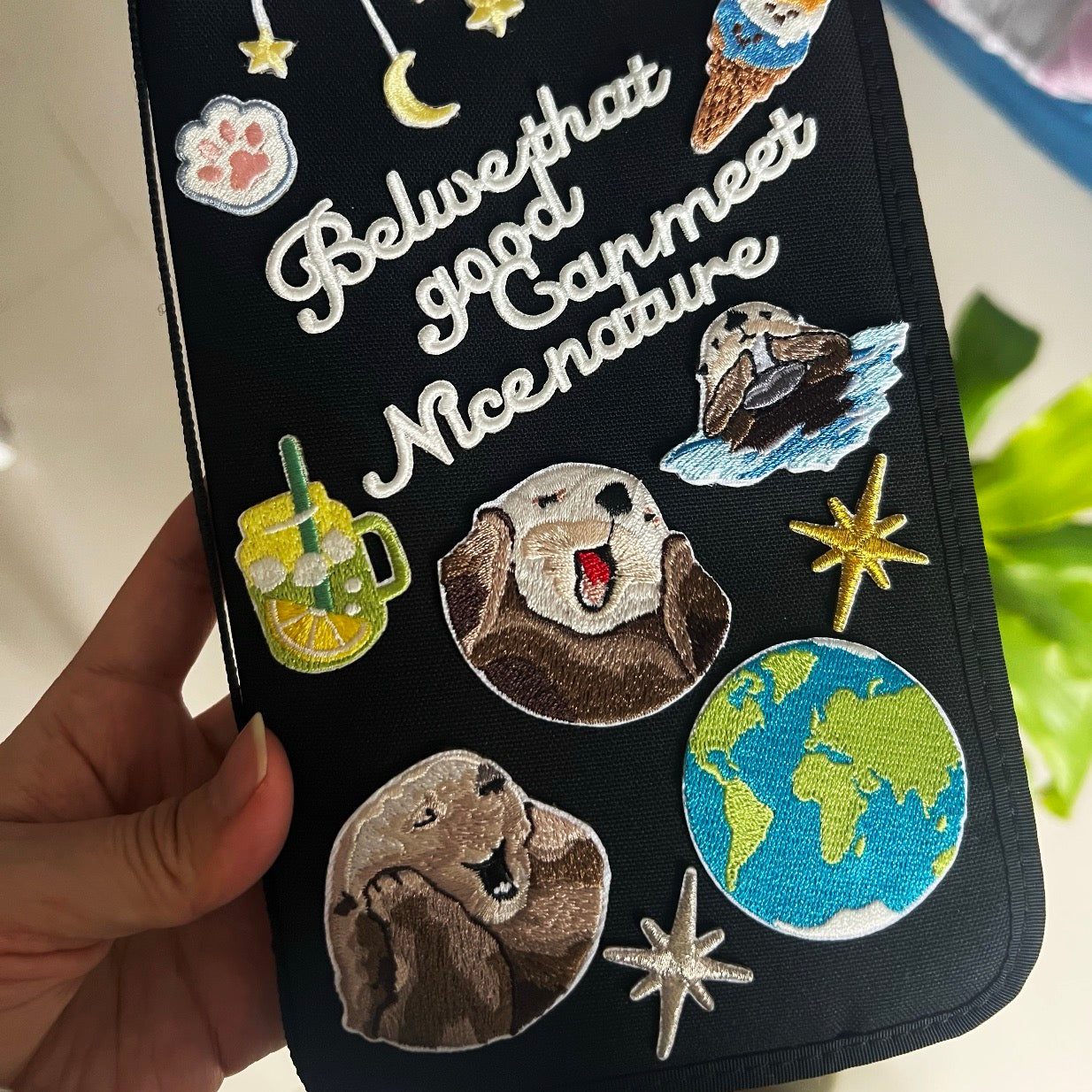 kawaii otter embroidered patch sticker on passport bag