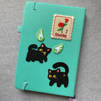 whimsical void cat embroidered patches on journal