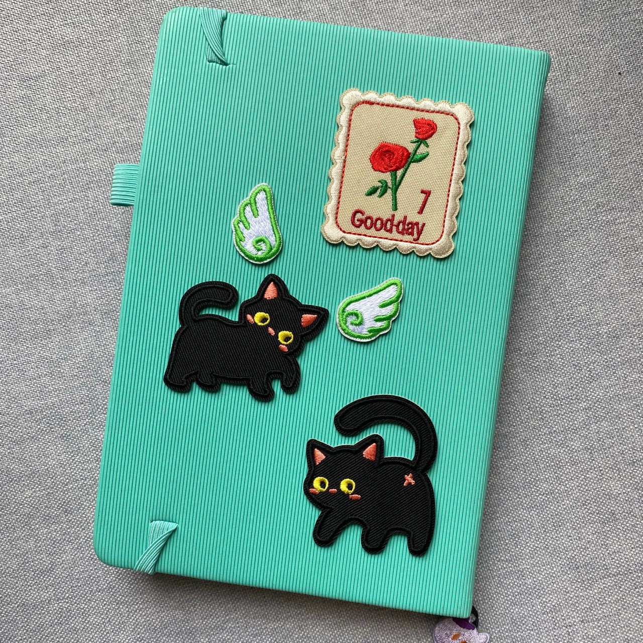 whimsical void cat embroidered patches on journal