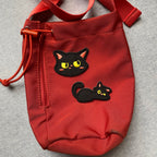 whimsical void cat embroidered patches on bag