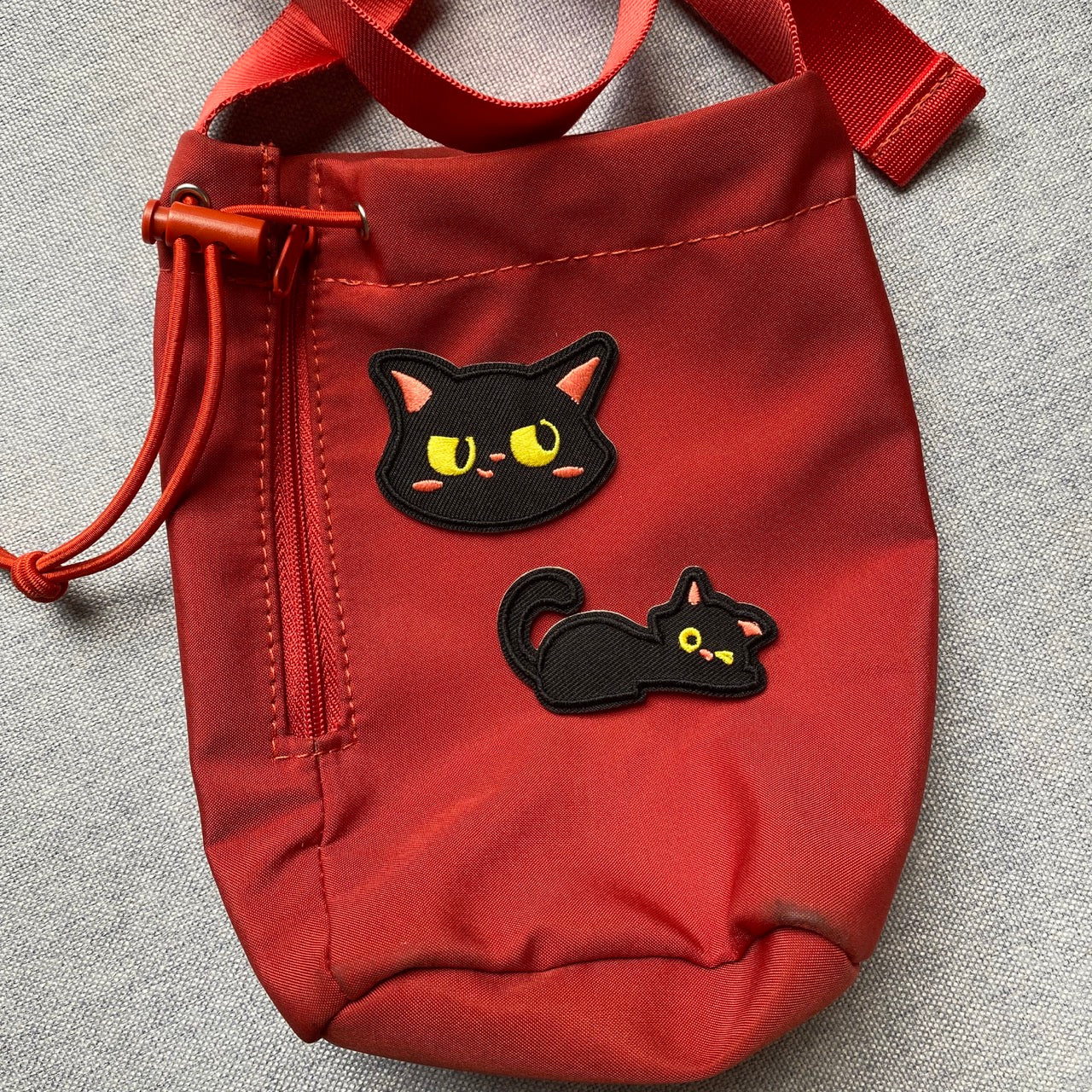 whimsical void cat embroidered patches on bag