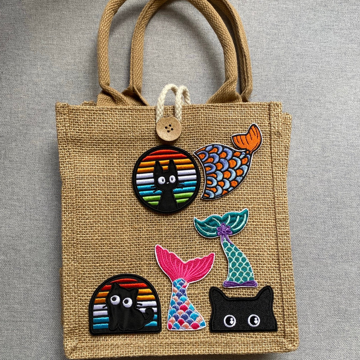 mermaid tail embroidered stick-on patch on jute tote bag