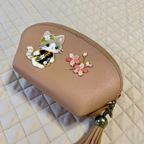 Black floral cheongsam calico cat stick-on patch on a makeup pouch