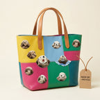 eight sea otter face patches with see no evil hear no evil laughing and floating poses on a bold multicolor tote