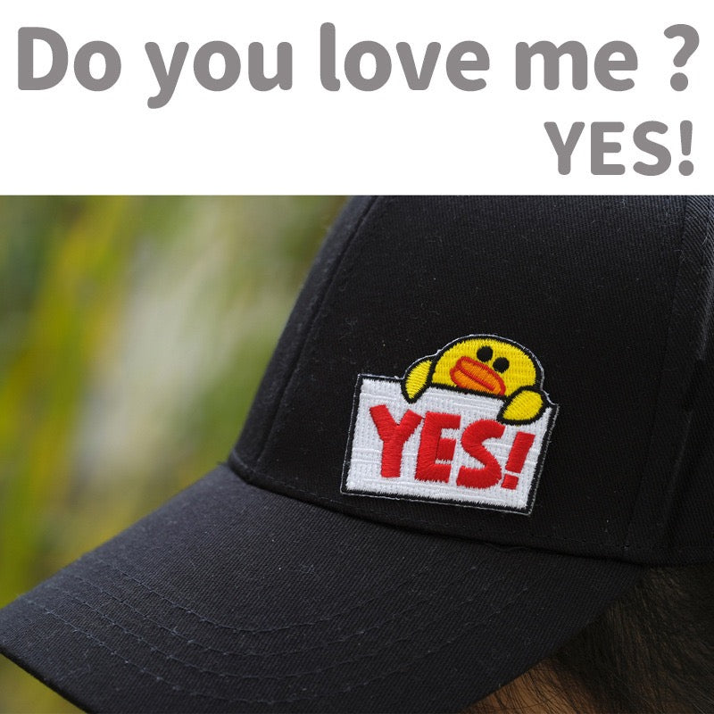 yellow duck embroidered patch on a hat