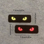 two glow-in-the-dark cat eye embroidered stick-on patches — yellow and red complete set