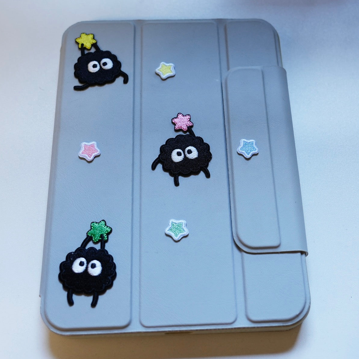 dreamy star embroidered stick-on patches on an iPad case