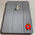 whimsical embroidered stick-on patches decorating an iPad case