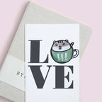 exclamation green teacup cat embroidered patch on journal cover letter O