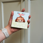 holding an adorable red panda embroidered stick-on patch