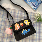 cute cartoon dinosaur embroidered stick-on patch on a crossbody bag