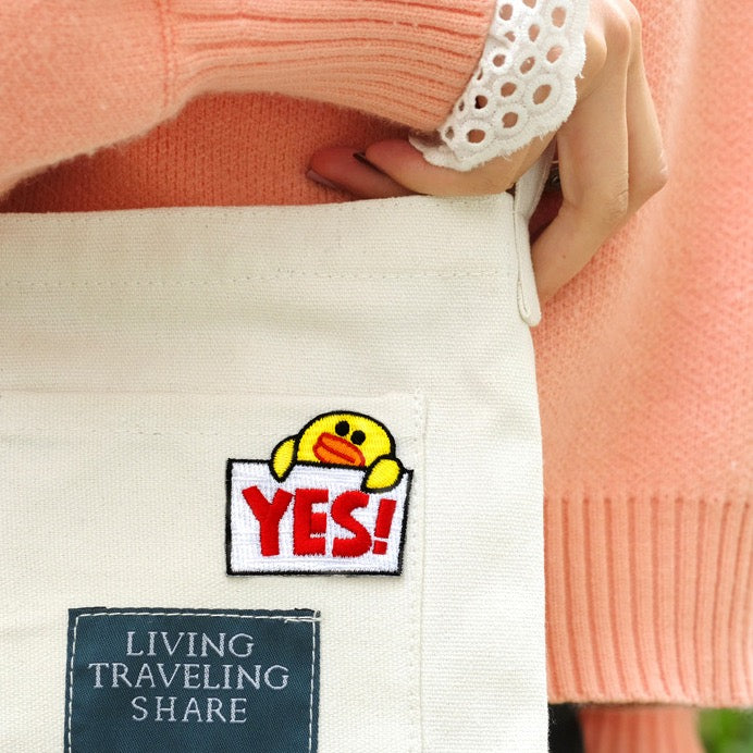 yes or no duck patch sticker on a canvas strap