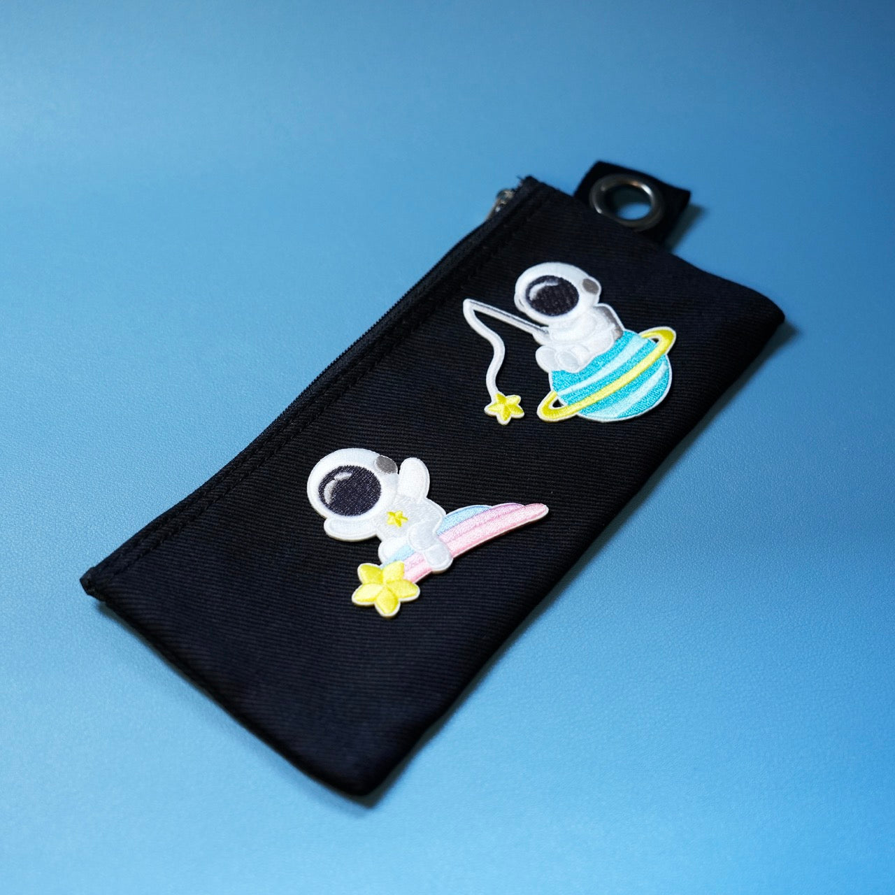 astronaut patch sticker on a pencil bag