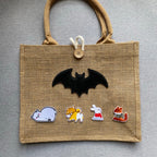 cozy winter fox and rabbit embroidered stick-on patches on a jute tote bag