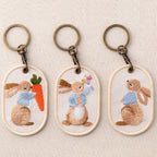 full set of three vintage storybook bunny double-sided embroidered keychain charms