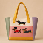 cute long dachshund stick-on patches in fun outfits decorating a soft pastel color-block leather handbag