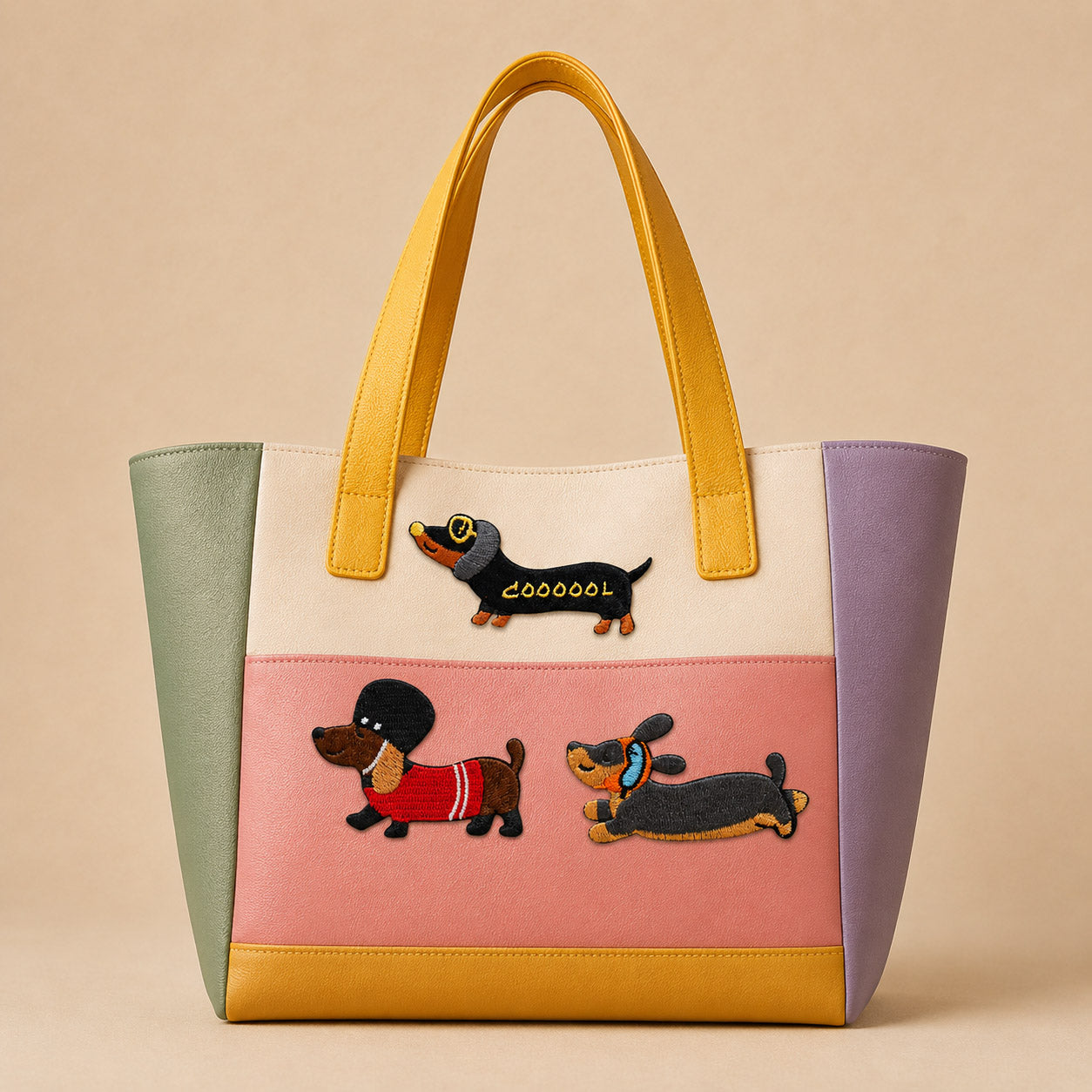 cute long dachshund stick-on patches in fun outfits decorating a soft pastel color-block leather handbag
