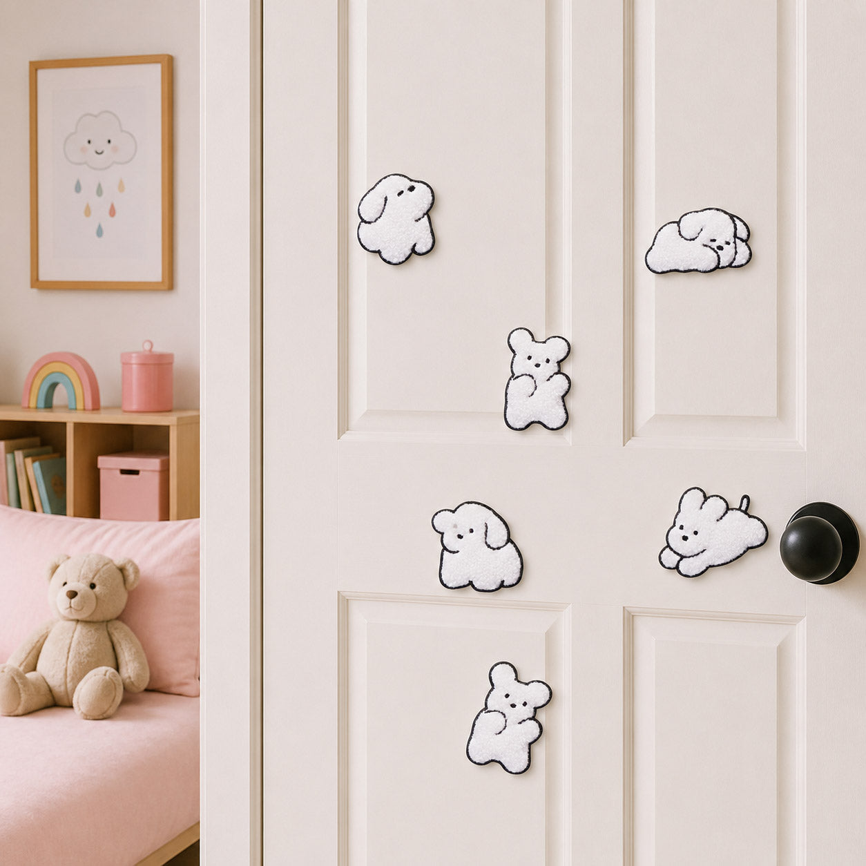 fluffy white maltese bichon puppy sitting lying standing and resting stick-on patches displayed on a white bedroom door