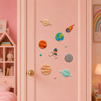 realistic planet patches including saturn jupiter earth moon and flaming meteor with floating astronaut and star stick-on patches on a pink door in a girls room