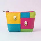 dainty white daisy embroidered stick-on patch on makeup pouch