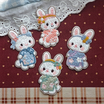 four traditional dress bunny embroidered stick-on patches complete set